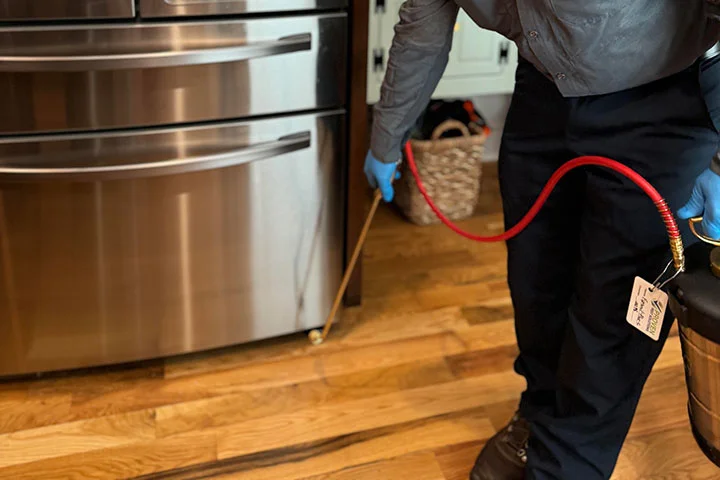 EntoLogic technician performing preventive pest maintenance in South Florida